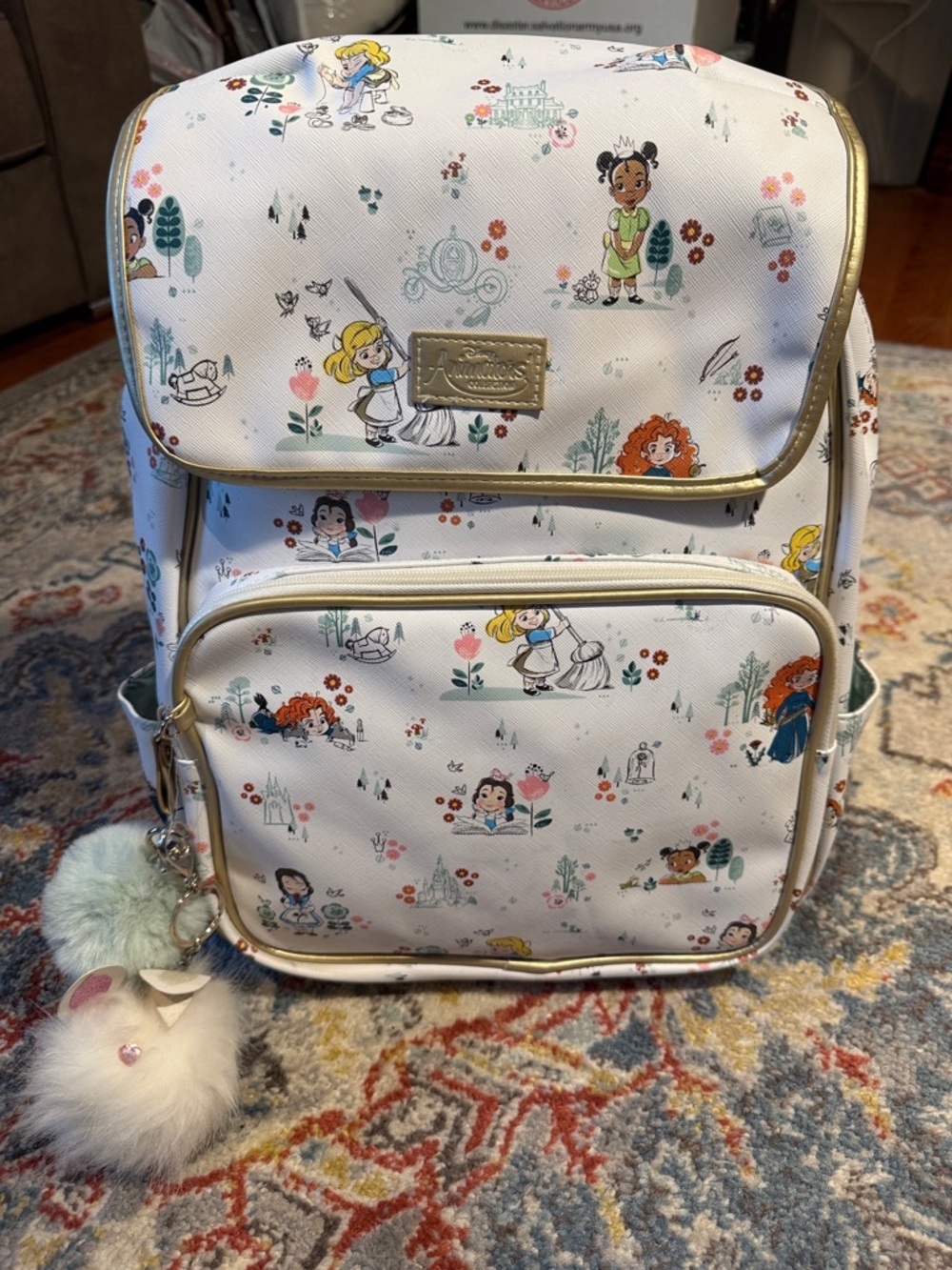 Disney White Kids Character Print Backpack with Gold Trim and Pom-Pom Charm